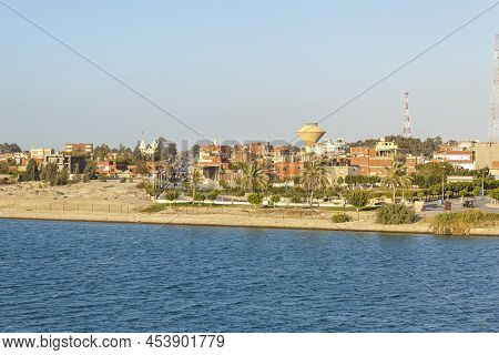 Suez Canal, Egypt - Mar 27 2013: Cityscape Of Ismailia, Seen From The Side Of Suez Canal.