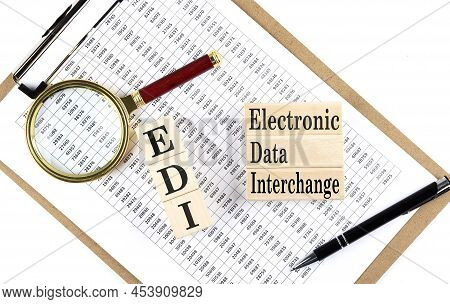 Paper With Edi -electronic Data Interchange A Table On Charts, Business Concept