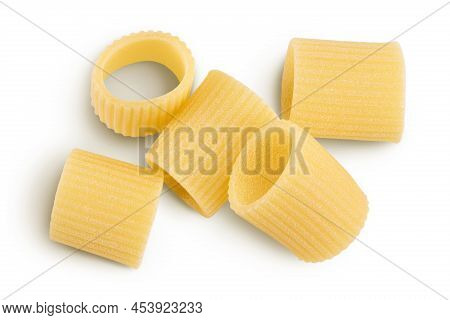 Raw Italian Pasta Isolated On White Background With Clipping Path . Mezze Maniche Rigate Bronze Die.