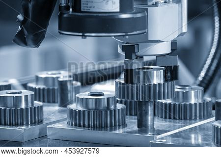 The Hi-technology  Material Handling Process By Robotic System With Metal Gear Parts. The Automatic 