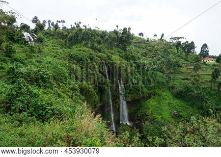 One Of The Sipi Falls Coming Out Of Lush And Dense Vegetation, Eastern Uganda