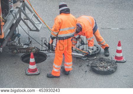 Street Works On Sewer Channel  With Warn Sign In German Words For Channel Works