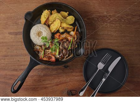 Peruvian D Food - Lomo Saltado - Beef Tenderloin With Purple Onion, Yellow Pepper, Tomatoes Served I