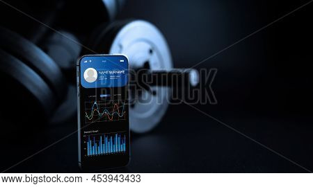 Health App. Smart Phone Screen With Fitness Health Or Sport Gym Mobile Application On Black Dumbbell