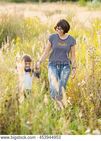 Cute Boy And His Mother Play With Toy Air Plane. Happy Kid Dreams To Be A Pilot. Boy Is Planning For