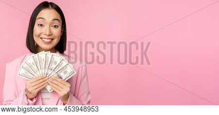 Finance, Microcredit And People Concept. Happy Smiling Asian Businesswoman Showing Dollars Money, St