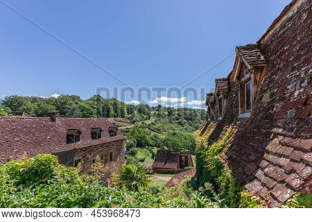 Small Medieval Settlement Near Castle Walls Of Fortress Chateau De Castelnau-bretenoux With Tiled Ro
