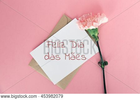 Craft Envelope, White Sheet Of Paper, One Pink Carnation Inscription Happy Mother S Day In Portugal 