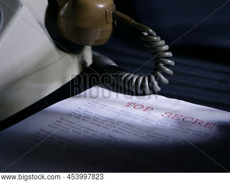 Top Secret Document In Dark Room With Vintage Phone