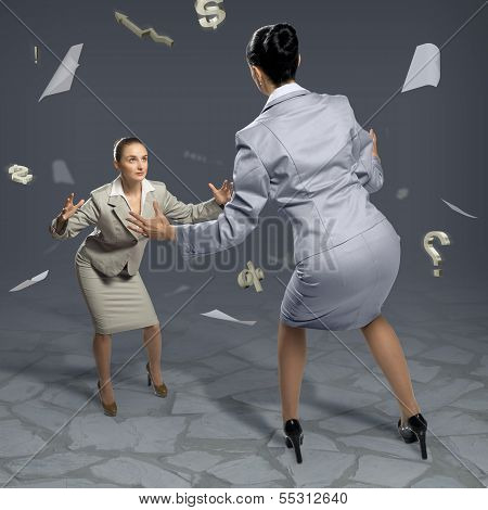 two businesswomen fighting as sumoist