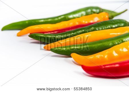 Red And Green And Yellow  Chilli Peppers On White Background