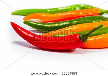 Red And Green And Yellow  Chilli Peppers On White Background