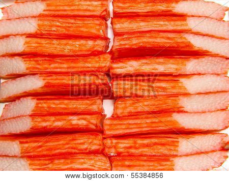 Imitation Crab Meat On A White Plate.