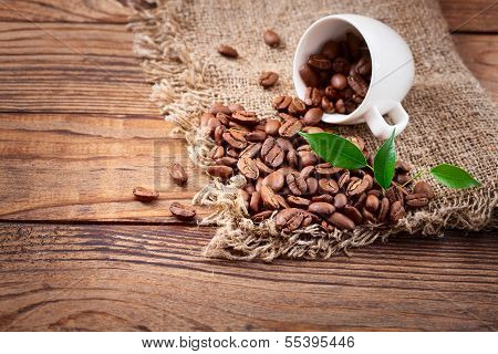 Coffee cup and saucer on  wooden table.