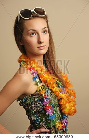 Girl with sunglesses and hawaiian wreath