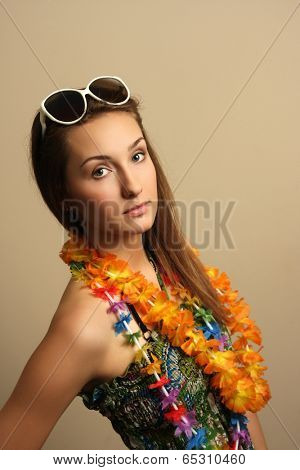 Girl with sunglesses and hawaiian wreath