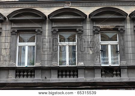 Three Window Of Grey Building