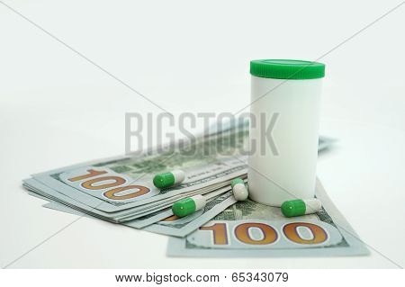 Medical tablets and dollars. Health care cost.