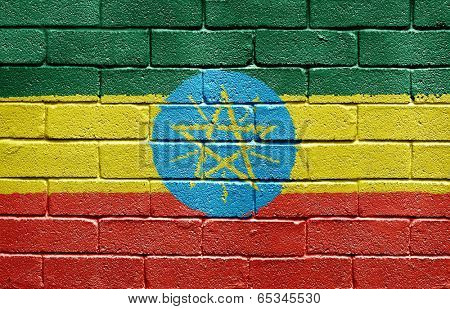 Flag of Ethiopia painted onto a grunge brick wall