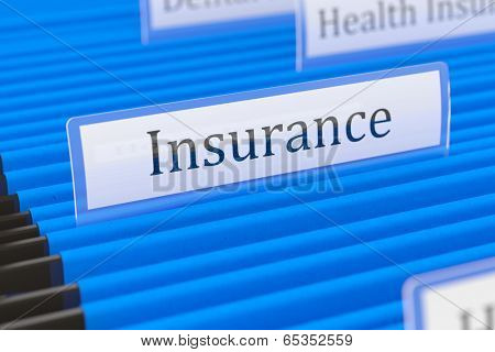 Blue hanging folder with insurance tag on it