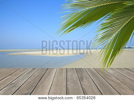 Wood Plank Over Beach With Coconut Palm Tree Leaf