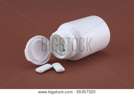White box with chewing gum on the brown background