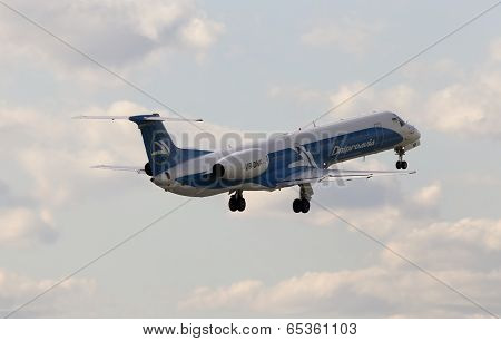 Dniproavia Airlines Embraer ERJ-145EU aircraft on the blue sky background