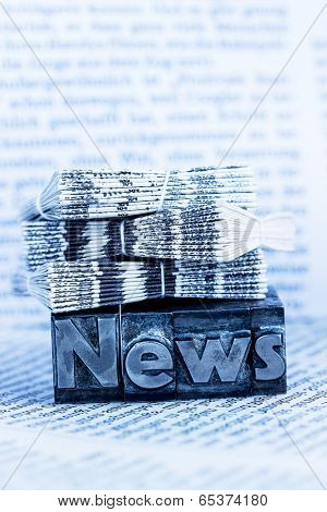 the word news written with lead letters. symbolic photo for newsletters, newspapers and information