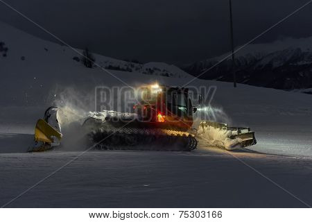 Snowcat Cleaning Slope In Night At Snow Resort Of Gudauri, Georgia