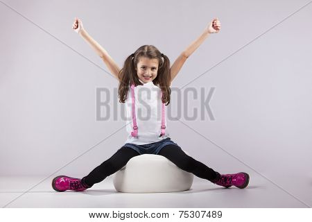 Girl at studio with her arms outstretched