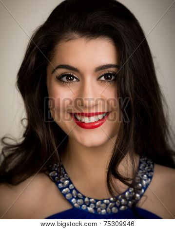 Portrait Of A Beautiful Smiling Young Brunette Woman