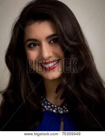 Portrait Of A Beautiful Smiling Young Brunette Woman