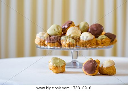 Profiterole cream puff - French dessert choux pastry ball filled with whipped cream