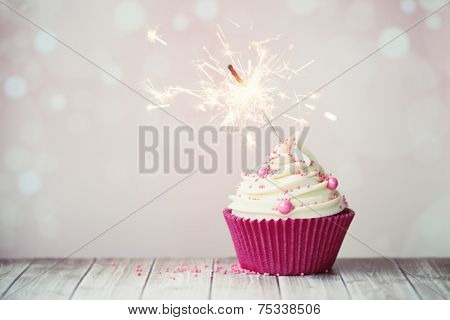 Pink birthday cupcake with sparkler