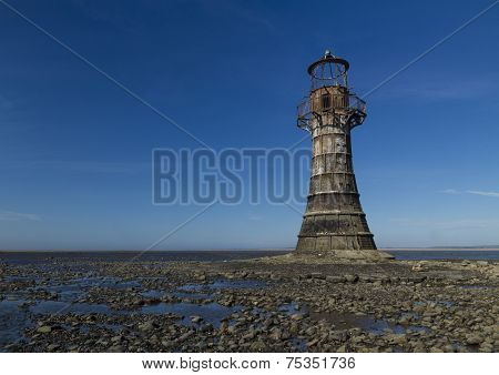 Ruined Derelict Lighthouse, Space To Top Left. Whiteford Sands, Gower Peninsula, South Wales. Blue S