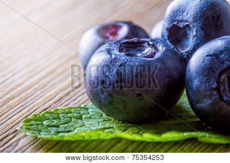 Fresh blueberries green leaves, citrus fruit - lemon limet
