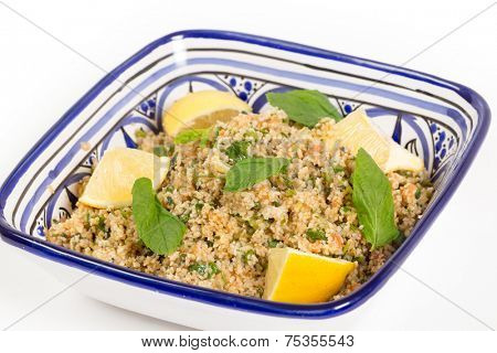 Turkish bulgur wheat salad, known as kisr, made with mint, cucumber,  lemon, romato and parsley,
