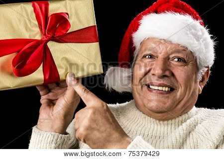Excited Aged Man Pointing At Golden Gift In Hand