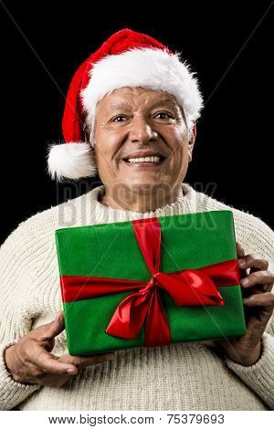 Male Senior With Santa Claus Cap And Green Gift