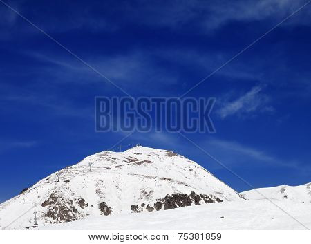 Winter Mountains And Ski Slope At Sun Day