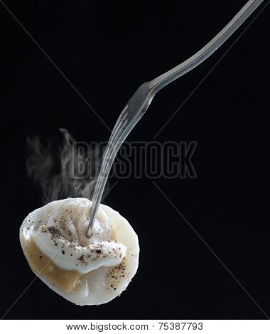 Appetizing hot meat dumplings with spices pinned on a plug