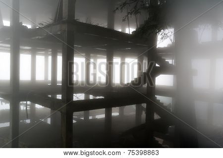 Building Under Construction In Fog