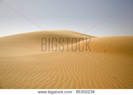 Sand dunes, weaves of dust in a beautiful desert