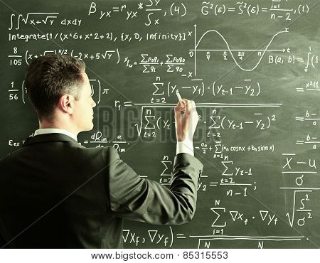 Businessman Writing Formula