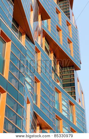 Modern building mirror facade in blue tone