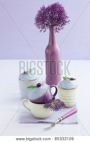 Three lavender cupcakes