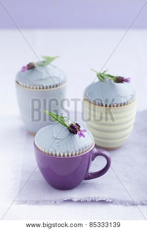 Three lavender cupcakes