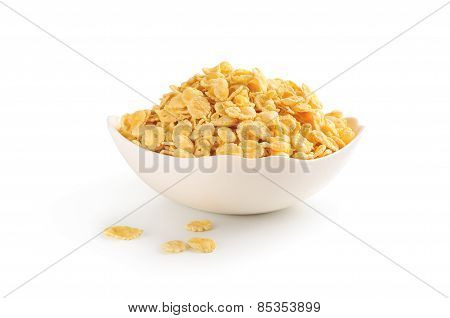 Cornflakes in porcelain bowl isolated on white background