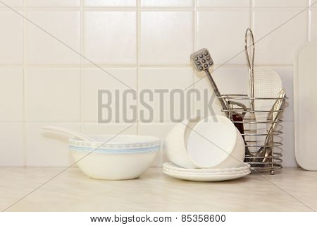 White Kitchenware On Kitchen Table.