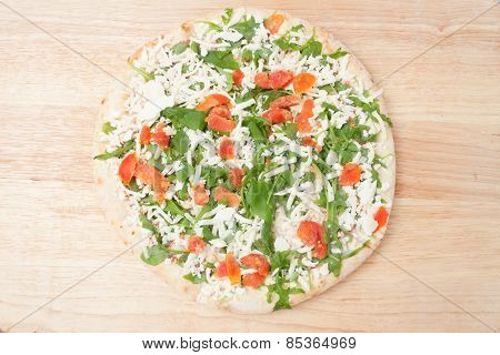 Frozen Pizza On Wooden Board